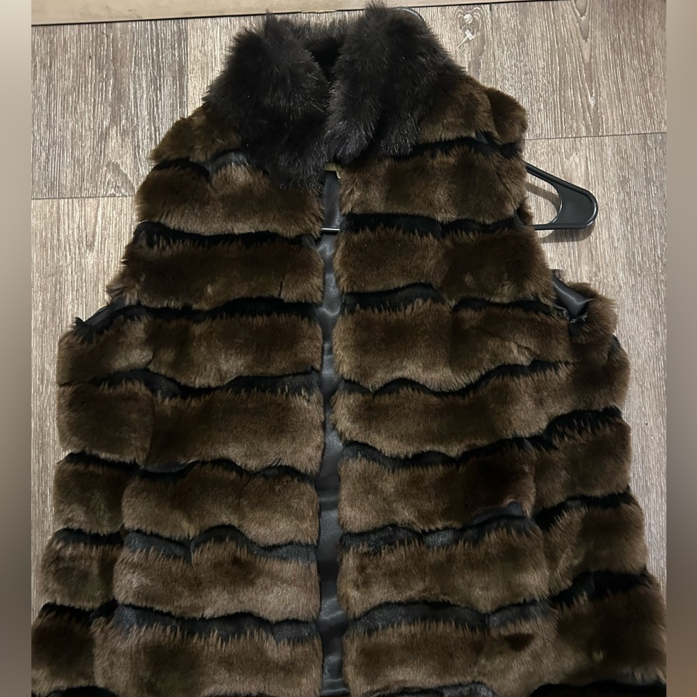High end evening fur vest. Size M and only wore once.